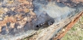 Hole along seam of tank showing leak